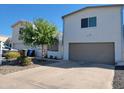 Modern two-story home with a two-car garage, desert landscaping, and a privacy gate at 3041 S Country Club Way, Tempe, AZ 85282