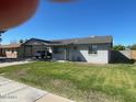 Picture of a cute single-story house with a nice front yard lawn at 3504 E Carol Ave, Mesa, AZ 85204