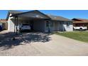 Cozy single-story house featuring a carport with driveway at 3504 E Carol Ave, Mesa, AZ 85204