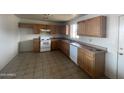 Traditional kitchen with white appliances, and tile floors at 3504 E Carol Ave, Mesa, AZ 85204