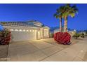 Charming single-story home featuring a well-manicured lawn, mature palm trees, and attached two-car garage at 3522 E Edna Ave, Phoenix, AZ 85032