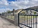 Wrought iron pedestrian gate into front yard with adjacent sidewalk at 421 E Desert Dr, Phoenix, AZ 85042