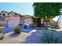 Charming home with desert landscaping, showcasing its inviting exterior at 7741 E Journey Ln, Scottsdale, AZ 85255