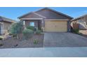 Charming single-story home featuring desert landscaping, and a two-car garage at 8490 S 165Th Dr, Goodyear, AZ 85338