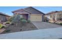 Charming single-story home featuring desert landscaping, and a two-car garage at 8490 S 165Th Dr, Goodyear, AZ 85338