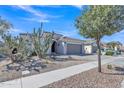 Charming single-story home featuring desert landscaping and a spacious two-car garage at 877 E La Costa Pl, Chandler, AZ 85249