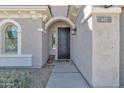 Inviting front entrance with decorative door and desert landscaping at 877 E La Costa Pl, Chandler, AZ 85249