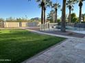 Large backyard featuring a swimming pool and lawn at 10249 N 58Th Pl, Paradise Valley, AZ 85253