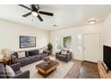 Bright living room featuring comfortable seating, a large window, and stylish decor at 11564 W Harrison St, Avondale, AZ 85323