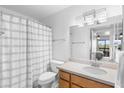 Bathroom featuring neutral finishes, a shower-tub combo, and view to main bedroom at 14645 N Fountain Hills N Blvd # 215, Fountain Hills, AZ 85268