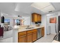 Kitchen featuring stainless steel appliances, breakfast bar and view to the living room at 14645 N Fountain Hills N Blvd # 215, Fountain Hills, AZ 85268