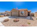 Charming single-Gathering home with beautiful, low maintenance desert landscaping and flowering bushes at 16573 W Alameda Rd, Surprise, AZ 85387