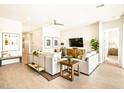 Neutral living room showcases natural light, contemporary furnishings, and stylish accents at 17633 W Pierson St, Goodyear, AZ 85395