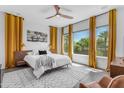 Inviting bedroom featuring warm-toned curtains, a comfortable bed, and plenty of natural light for a relaxing atmosphere at 187 E Santa Lucia Ln, Queen Creek, AZ 85140