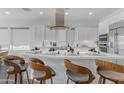 Contemporary kitchen features a large island with bar seating and modern finishes, creating an inviting space at 187 E Santa Lucia Ln, Queen Creek, AZ 85140