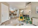 Open floor plan with tile entryway flowing into a living space with an adjacent kitchen at 3330 S Gilbert Rd # 2090, Chandler, AZ 85286