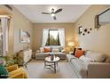 Cozy living room featuring neutral tones, comfortable seating, and a bright window view at 3330 S Gilbert Rd # 2090, Chandler, AZ 85286
