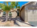 Inviting front entrance with a well-maintained walkway, desert landscape, and neutral-toned exterior at 3544 E Tonto Ln, Phoenix, AZ 85050