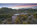Expansive desert estate with stunning mountain views, mature trees, and a private drive leading to the home at 36190 N Creek View Ln, Cave Creek, AZ 85331