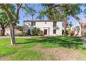 Captivating front exterior of a home with well-kept lawn and mature palm trees at 374 E Verde Ln, Phoenix, AZ 85012