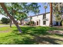 Exterior view of a home with a well-manicured lawn and beautiful landscaping at 374 E Verde Ln, Phoenix, AZ 85012