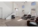 Spacious living room boasts high ceilings, a staircase, and ample natural light at 3875 E Juanita Ave, Gilbert, AZ 85234