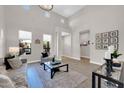 Spacious living room with high ceilings, lots of windows, and neutral decor at 4013 N Founder Cir, Buckeye, AZ 85396