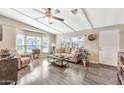 Bright living room boasts wood floors, neutral walls, and large windows for natural light at 5402 E Mckellips Rd # 298, Mesa, AZ 85215