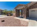 A sophisticated gated entrance features stone pillars, providing both security and curb appeal at 5430 S 23Rd Way, Phoenix, AZ 85040
