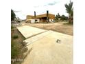 View of the exterior property under construction with dirt and cement base at 5550 E Shea Blvd, Scottsdale, AZ 85254