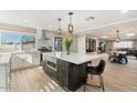 Spacious kitchen with a large island, stainless steel appliances, and ample counter space for cooking at 8213 E Fairmount Ave, Scottsdale, AZ 85251