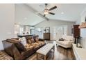 Open-concept living area featuring hardwood floors, large windows, and vaulted ceilings providing abundant natural light at 8227 N 15Th Pl, Phoenix, AZ 85020