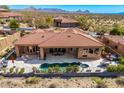 Gorgeous backyard with a private pool, lounge area, and desert views, perfect for outdoor living and entertaining at 9630 E Preserve Way, Scottsdale, AZ 85262