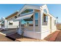This charming home offers covered parking, large windows, and easy-care desert landscaping at 9736 E Main St # 43, Mesa, AZ 85207