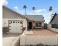 Inviting single-Gathering home featuring a tidy front yard, attached garage, and classic design at 9853 E Birchwood Ave, Mesa, AZ 85208