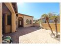 Paver patio showcasing a water feature and easy access to the home's main entry at 12439 W Yellow Bird Ln, Peoria, AZ 85383