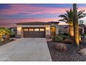 Inviting home featuring a well-maintained driveway and attractive desert landscaping at 13065 W Lucia Dr, Peoria, AZ 85383