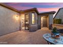 A beautiful, brick-paved patio featuring outdoor seating at 13065 W Lucia Dr, Peoria, AZ 85383