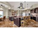 Spacious kitchen with stainless steel appliances, custom cabinets, pendant lighting and breakfast bar seating at 15106 E Miravista --, Fountain Hills, AZ 85268