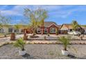 Well-manicured front yard with lush landscaping and a decorative fountain, enhancing curb appeal at 1533 W Culver St, Phoenix, AZ 85007