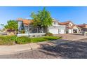 Charming two-story home featuring a well-manicured lawn and a spacious three-car garage at 2218 E Mallard Ct, Gilbert, AZ 85234