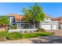 Lovely home boasting a well-maintained lawn, a decorative front wall, and a three-car garage at 2218 E Mallard Ct, Gilbert, AZ 85234
