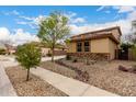 Charming two-story home with decorative stone accents and a low-maintenance landscaped front yard at 27071 N 172Nd Ln, Surprise, AZ 85387