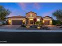 Charming single-story home showcasing a stone accent, two-car garage, and desert landscaping at 30311 N 52Nd Pl, Cave Creek, AZ 85331