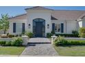 Inviting front entrance with brick walkway, arched entry, and decorative landscaping at 3173 E Page Ave, Gilbert, AZ 85234