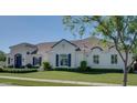 Lovely home featuring manicured landscaping, a tile roof, and white exterior paint at 3173 E Page Ave, Gilbert, AZ 85234