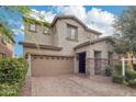 Charming two-story home with desert landscaping, a two-car garage, and stone accents at 3471 E Azalea Dr, Gilbert, AZ 85298