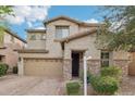 Charming two-story home with desert landscaping, a two-car garage, and stone accents at 3471 E Azalea Dr, Gilbert, AZ 85298