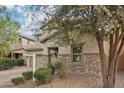 Charming two-story home with desert landscaping, a two-car garage, and stone accents at 3471 E Azalea Dr, Gilbert, AZ 85298