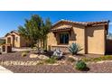 Well-manicured front yard featuring desert landscaping, native plants, and a view of the home's exterior at 6112 E Calle De Pompas --, Cave Creek, AZ 85331